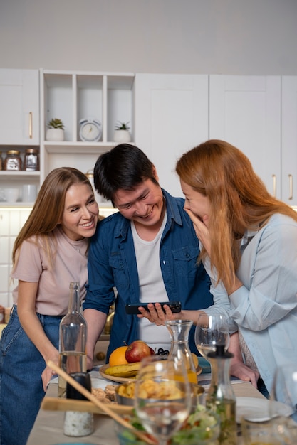 Friends having fun together while cooking