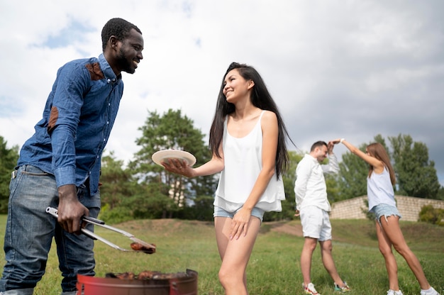 Friends having fun while barbecuing