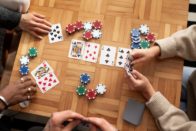 Free photo friends having fun while playing poker