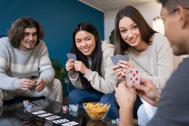 Free photo friends having fun while playing poker