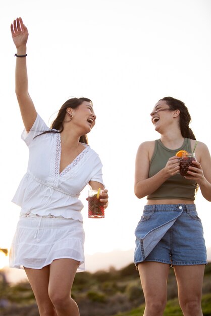 Friends having a sangria party by the beach