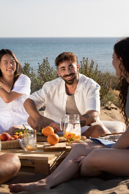 Friends having a sangria party by the beach