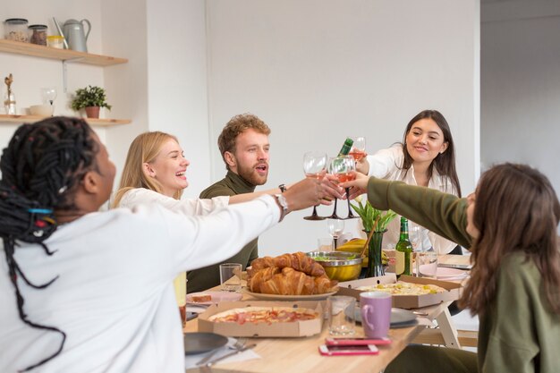 Friends at home toasting