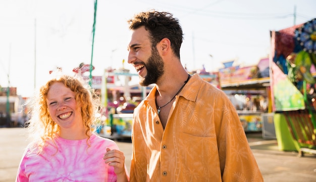 Friends laughing at the funfair