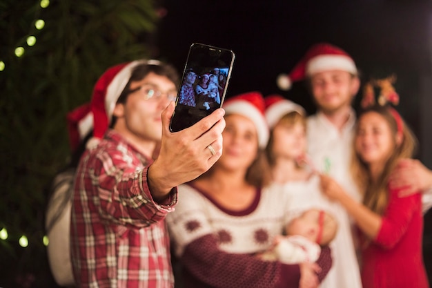 Free photo friends making selfie at christmas party