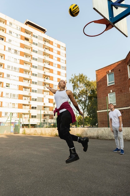 Free Photo friends playing basketball full shot