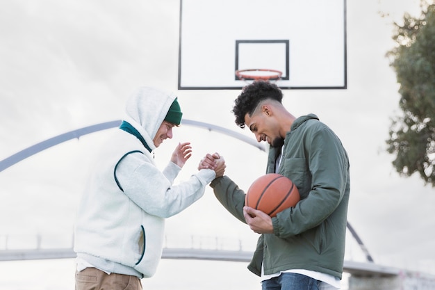 Friends playing basketball