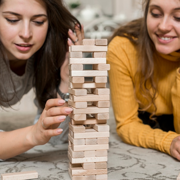 Friends playing jenga