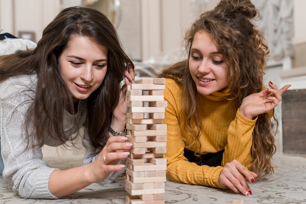 Friends playing jenga