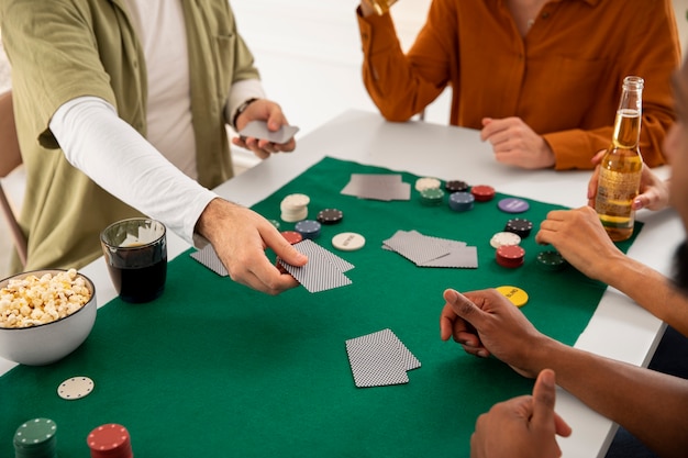 Free photo friends playing poker together