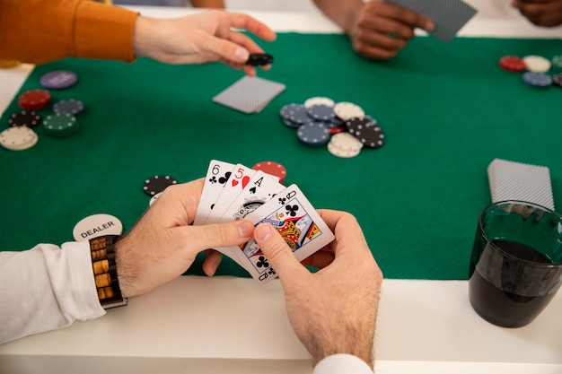 Free photo friends playing poker together