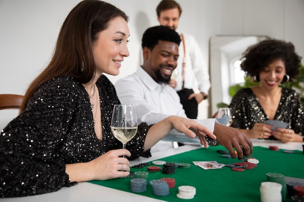 Free photo friends playing poker together