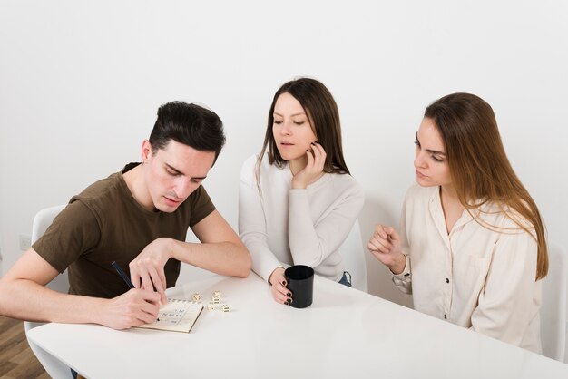 Friends playing yahtzee game