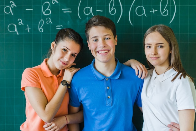 Friends posing in maths class