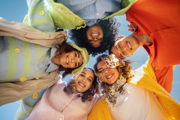 Friends posing in an outdoor field