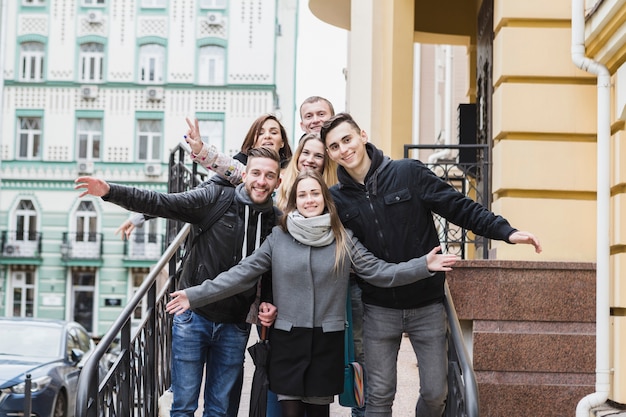 Friends posing on town street