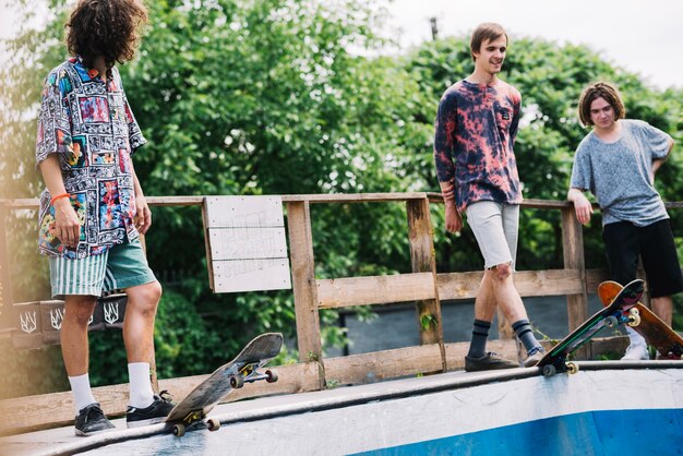 Friends on ramp with skateboards