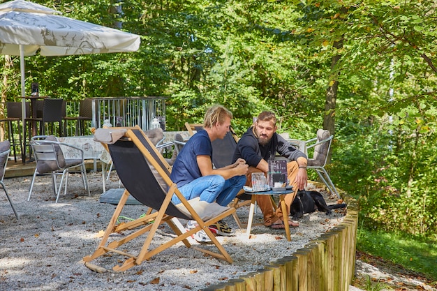 Friends relaxing at the terrace of a cafe