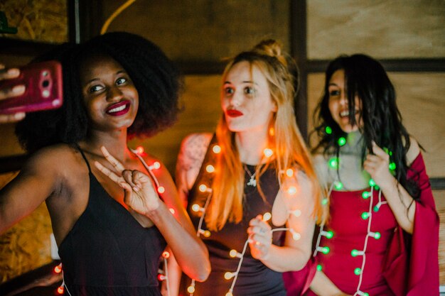 Friends selfie with light bulbs