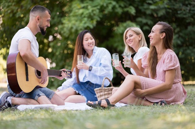 Friends singing and playing guitar after coronavirus