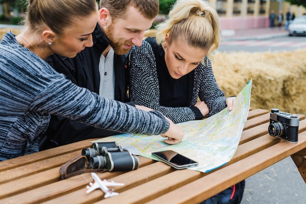 Free Photo friends sitting and choosing destination