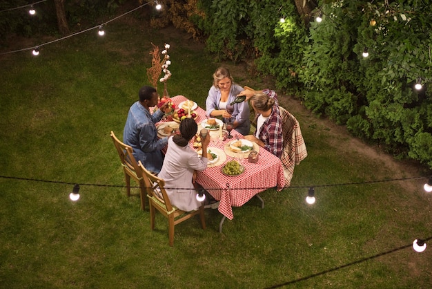 Friends sitting at table high angle