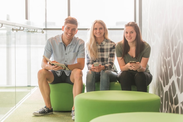 Friends smiling in college