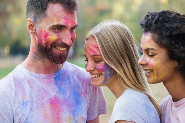 Friends smiling while posing at festival