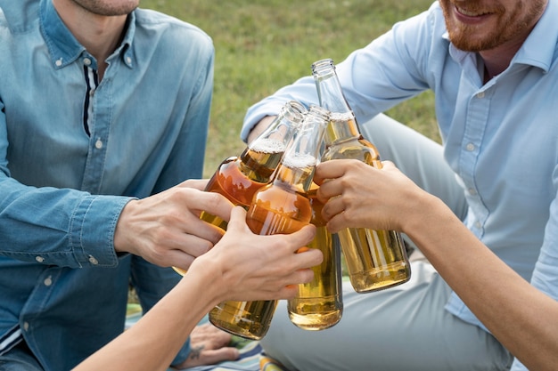 Friends spending time together outdoors and having beer