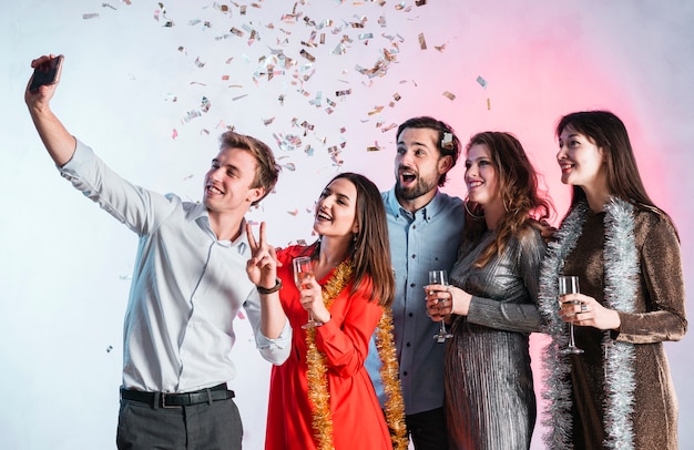 Friends taking a selfie at new year party