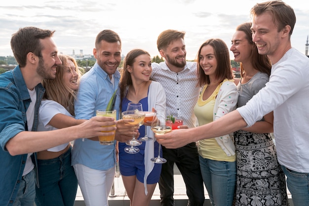 Friends toasting at a terrace party