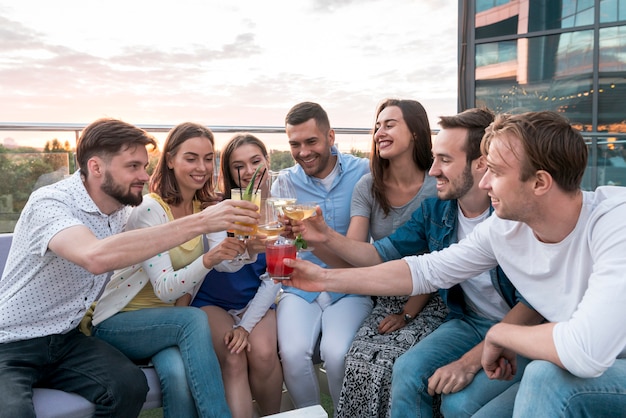 Free Photo friends toasting at a terrace party