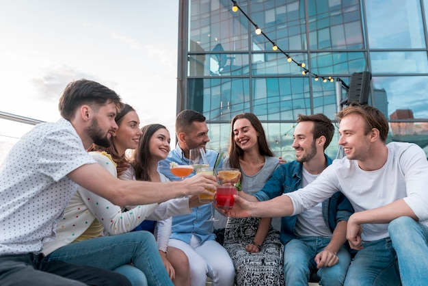 Friends toasting at a terrace party