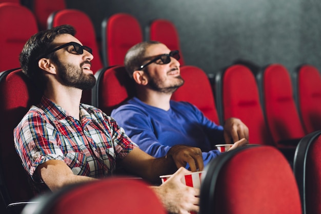 Friends watching movie in cinema