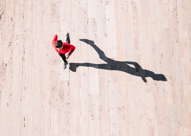 Free Photo from above athlete running on pavement