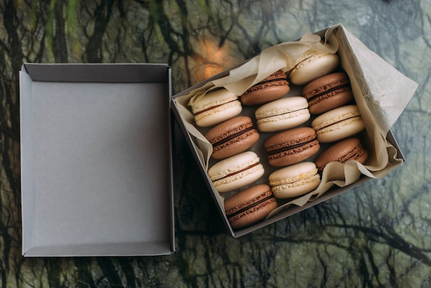 From above box with macaroons