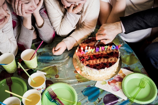 Free photo from above hand lighting candles near girls