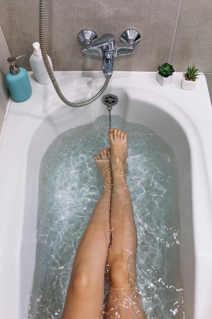 Free Photo from above legs in bathtub