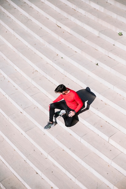 Free Photo from above man relaxing on steps