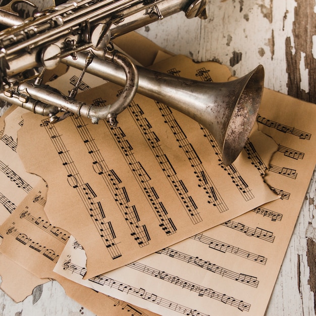 Free Photo from above trumpet and saxophone on sheet music