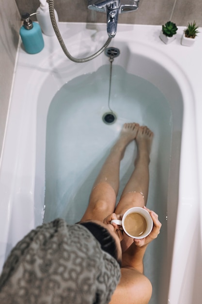 Free Photo from above woman drinking coffee in bath