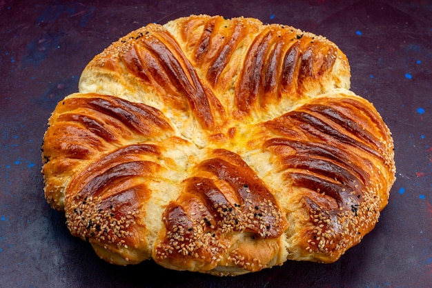 Front close view delicious pastry baked bun on dark background.