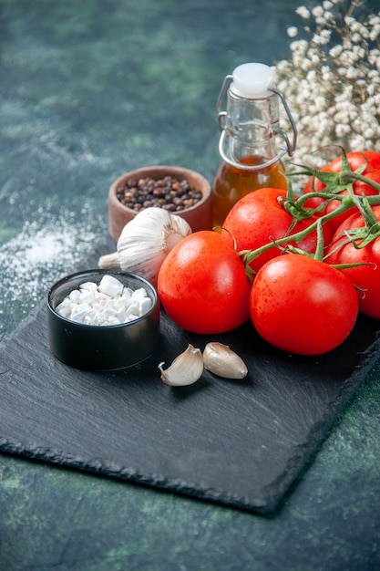 front close view fresh red tomatoes with seasonings on dark surface color meal food health diet salad