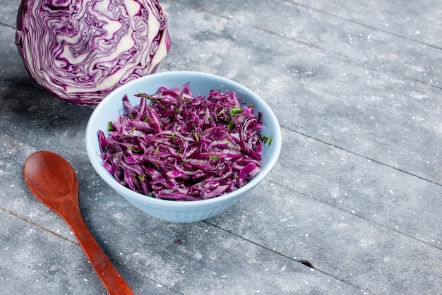 Free Photo front close view purple cabbage ripe fresh sliced and whole on the grey rustic surface vegetable ripe food vitamine color