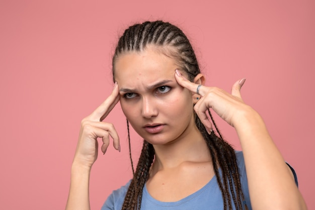 Front close view of young girl concentrated on pink