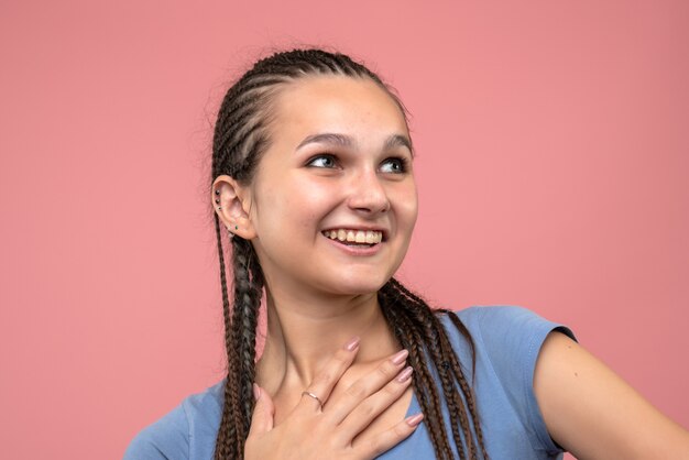 Front close view young girl smiling on pink