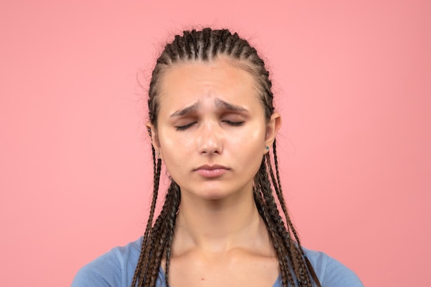 Free photo front close view young girl stressed and sad on pink