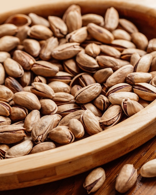 A front closed-up view fresh peanuts salted and tasty on the table nut peanut snack