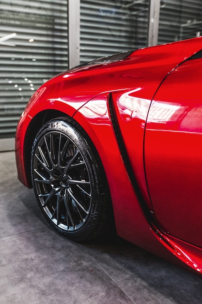 Free photo front left wheel of a red luxury car