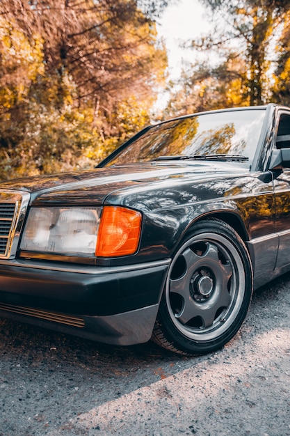 Free photo front side and lights of a vintage black sedan car.